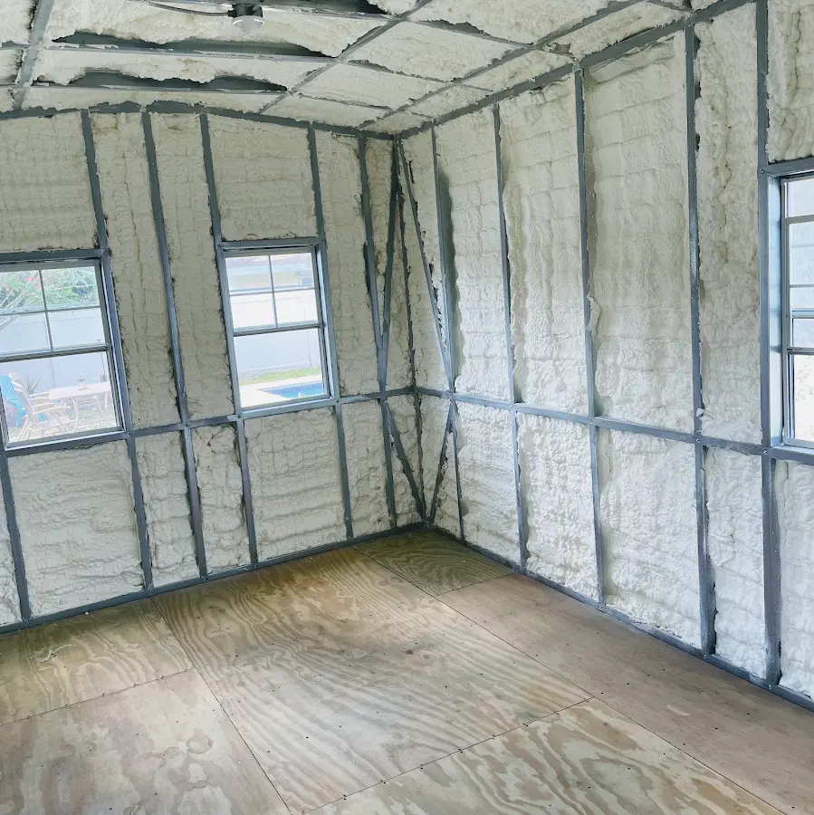 Closed-cell spray foam insulation applied to wall cavities in a residential project in Grand Blanc